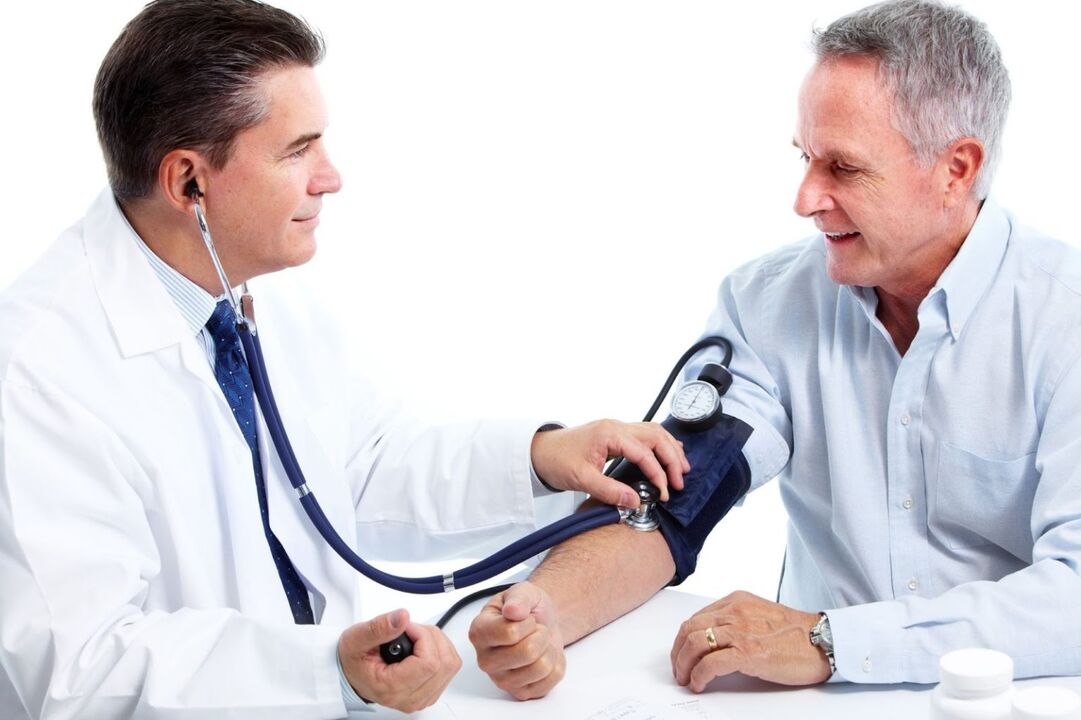 The doctor measures the patient's pressure with hypertension
